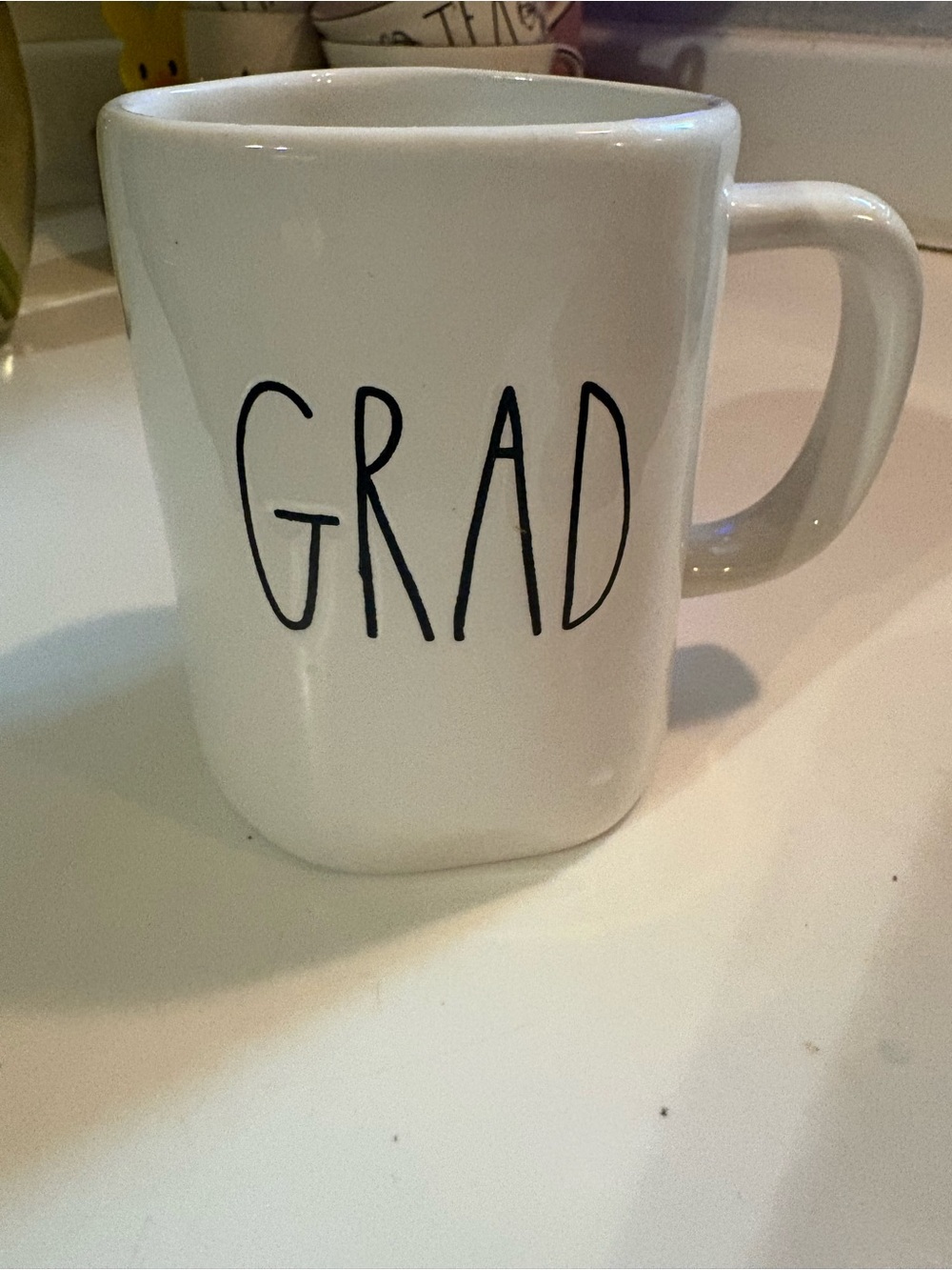 Rae Dunn White 'GRAD' Ceramic Mug with Black Lettering